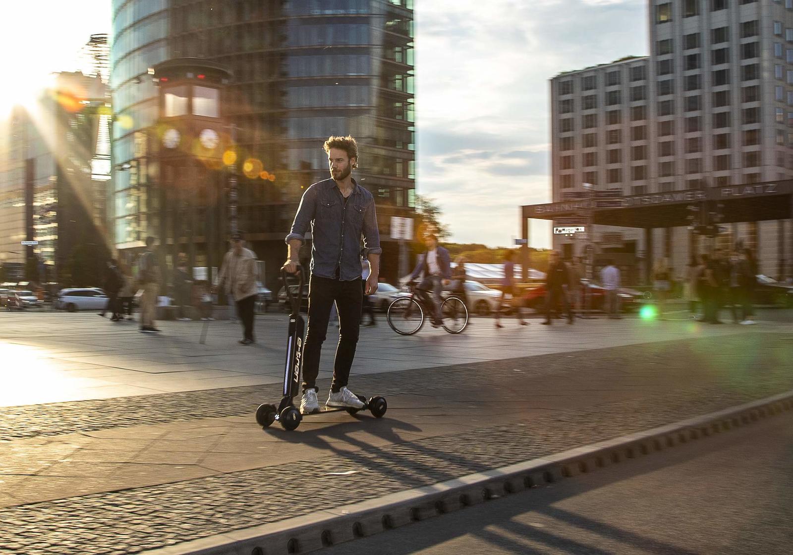 Audi combines e-scooter with skateboard
