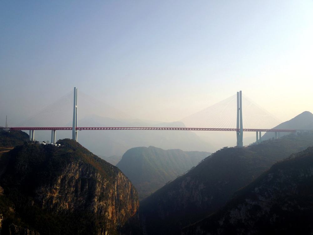 An aerial view shows the Beipanjiang Bridge, connecting Guizhou and Yunnan provinces, which is reported as world’s highest bridge according to local media
