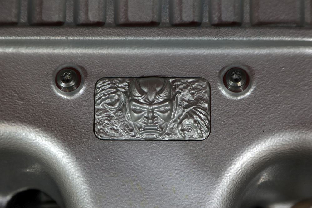 Custom Demon diecast emblem located on the cover of the 6.2-lite