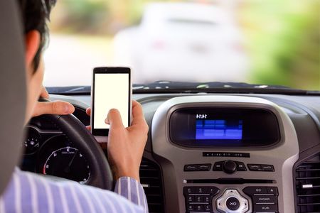 40651922 – driving while holding a mobile phone (cell phone use while driving)