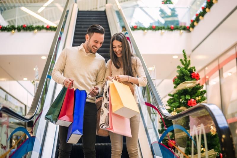 Loving couple doing Christmas shopping together