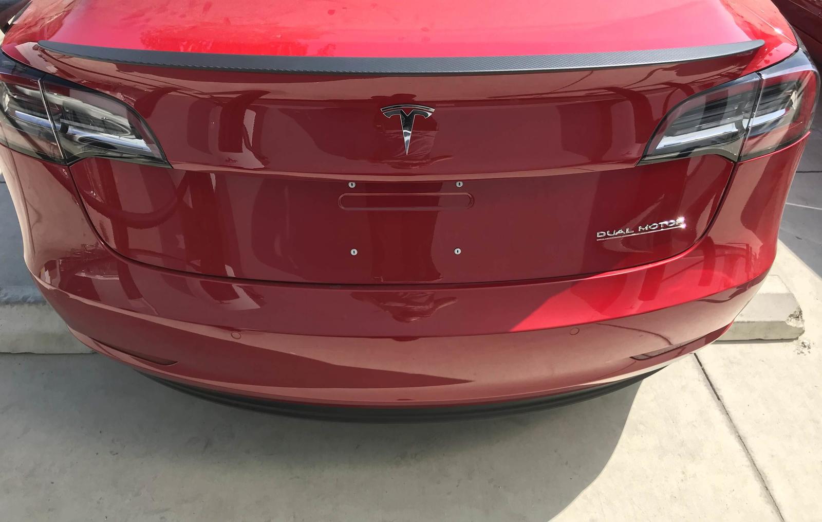 model-3-performance-spoiler-badge-1-1-e1532025493910