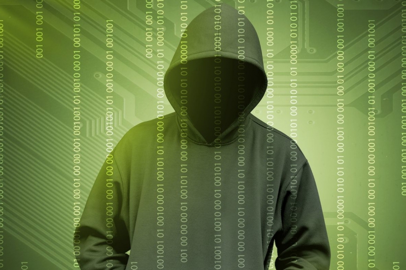 Computer hacker silhouette of hooded man