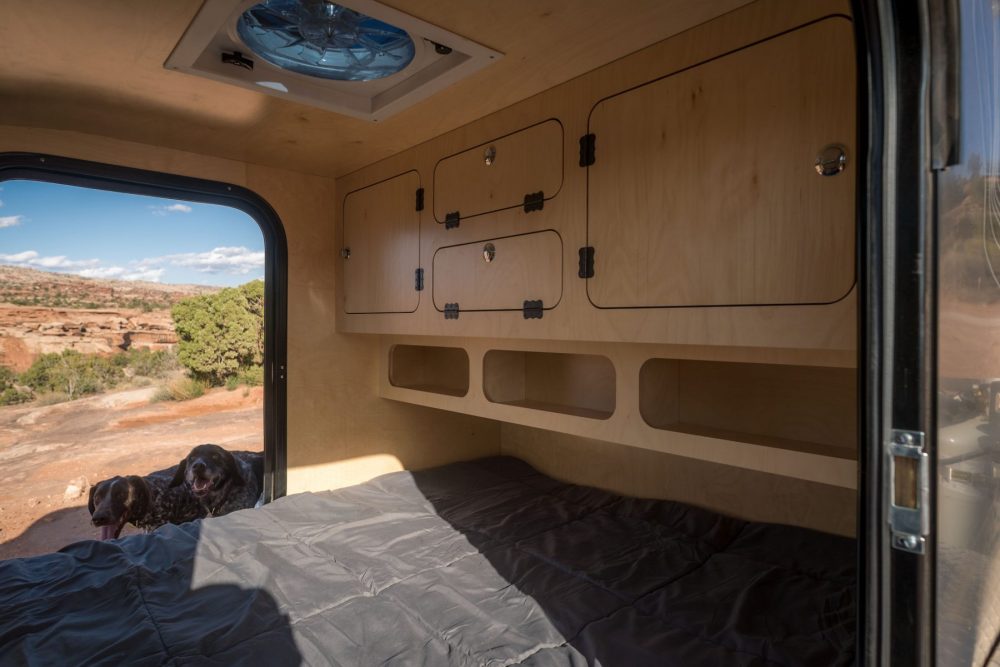 escapod-teardrop-trailer-rental-interior-cabinets-bed-fan-door-1800×1200