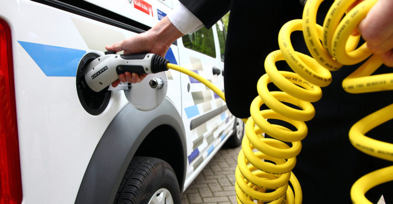 Electric vehicle, van. Powered by electricity. Charging the batteries.