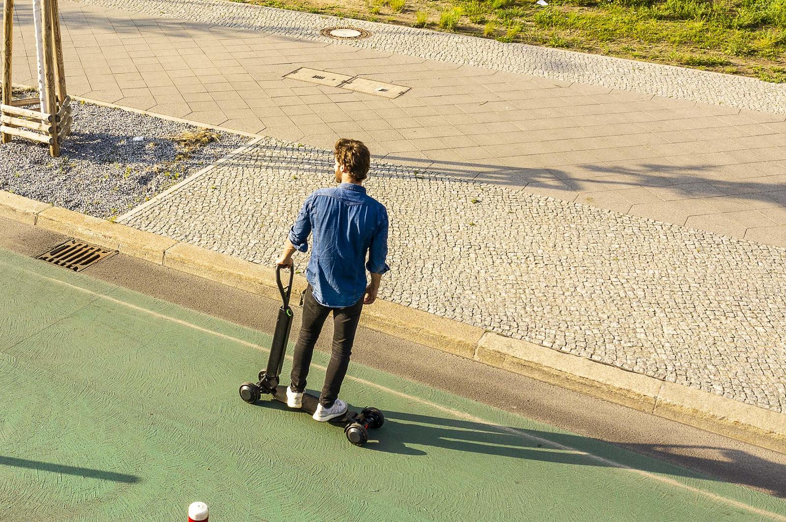 Audi combines e-scooter with skateboard