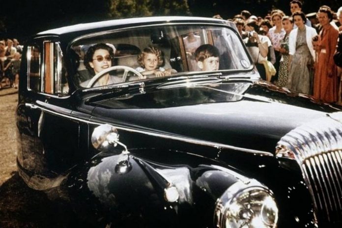 1957_queen_elizabeth_driving_her_children_prince_charles_and_princess_anne_in_windsor
