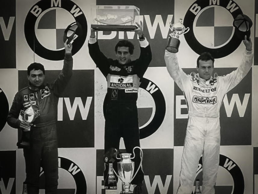 The Estoril GP Podium 1985 (L-R) Michele Alboreto, Ayrton Senna, Patrick Tambay Credit_Classic Team Lotus